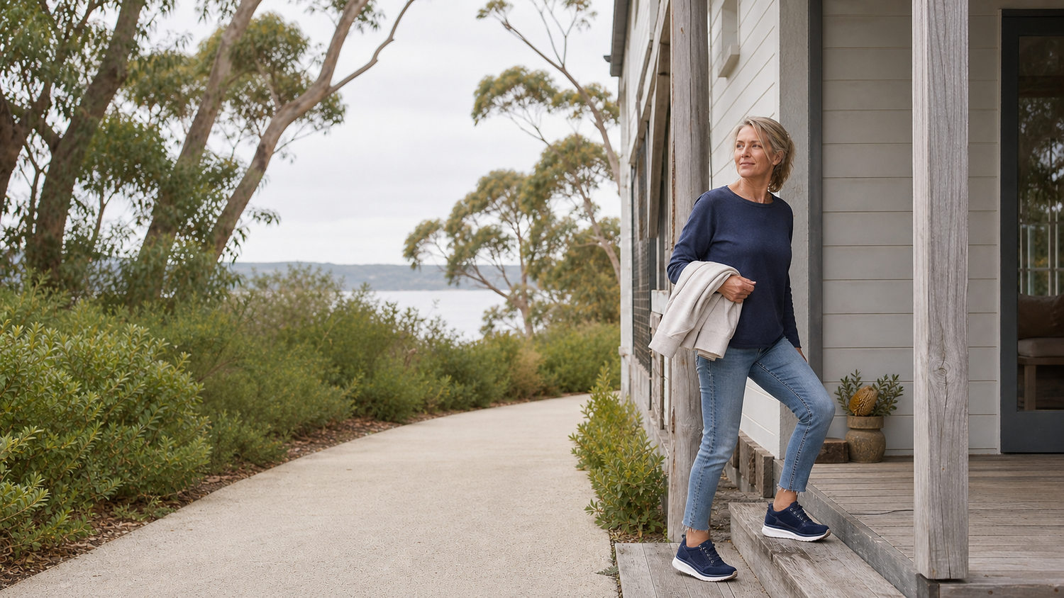 Woman wearing navy comfort shoes on an Australian coastal verandah